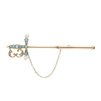 Lot 133 - An Edwardian gold turquoise and pearl sword jabot pin