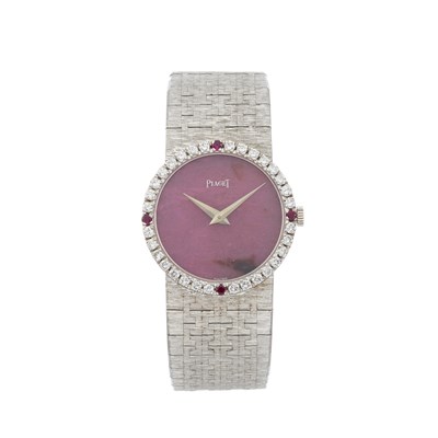 Lot 248 - Piaget, an 18ct white gold diamond and ruby set bracelet watch