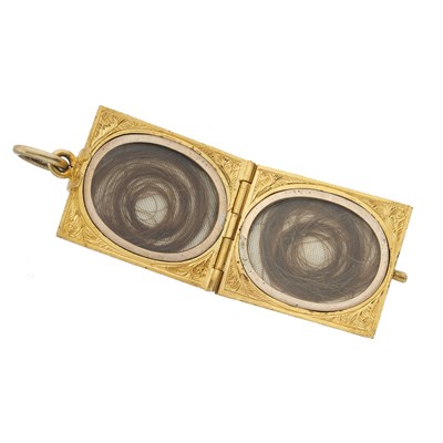 Lot 16 - A late Victorian gold black enamel locket pendant