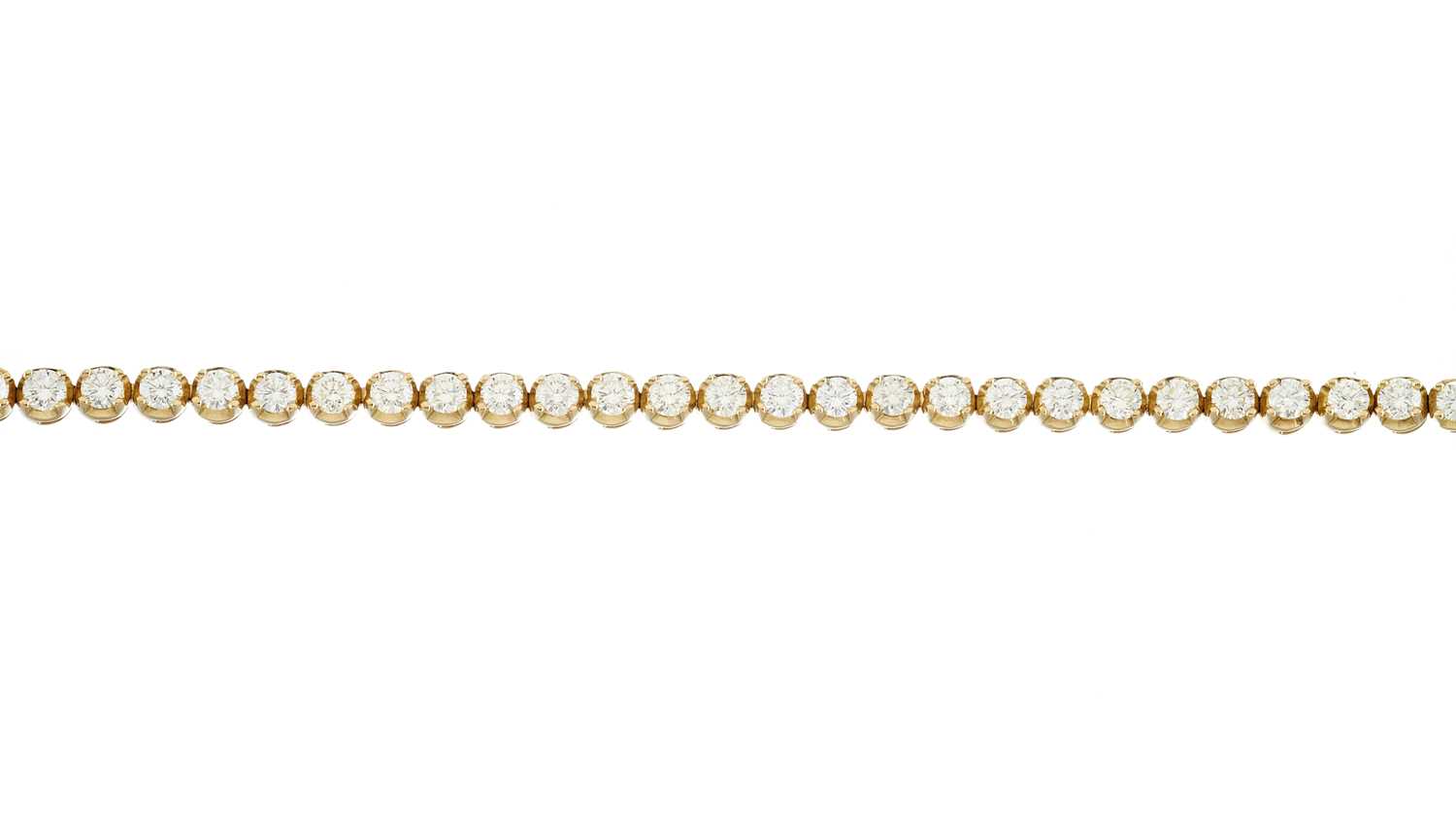 Lot 46 - An 18ct gold diamond line bracelet