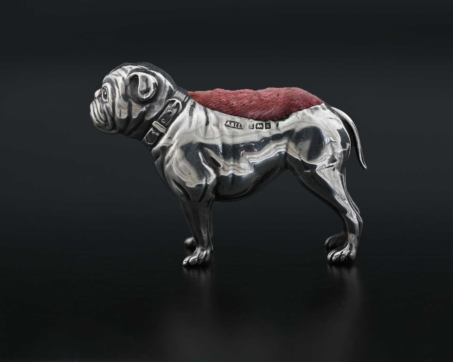 Lot 54 - An Edwardian novelty silver pin cushion,...