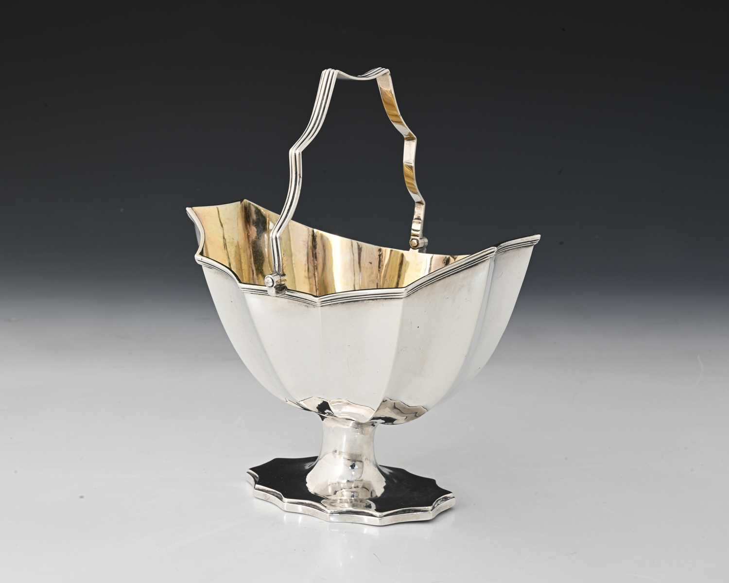 Lot 156 - A George III silver swing handle basket, of...