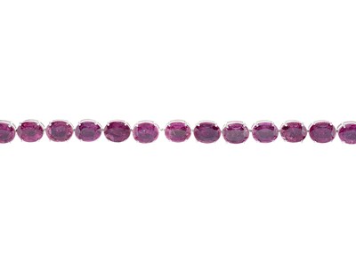 Lot 144 - An 18ct gold ruby line bracelet
