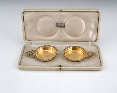 Lot 302 - Harrods, a George V cased pair of silver gilt...