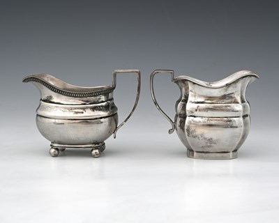 Lot 163 - Two hallmarked silver cream or milk jugs, both...
