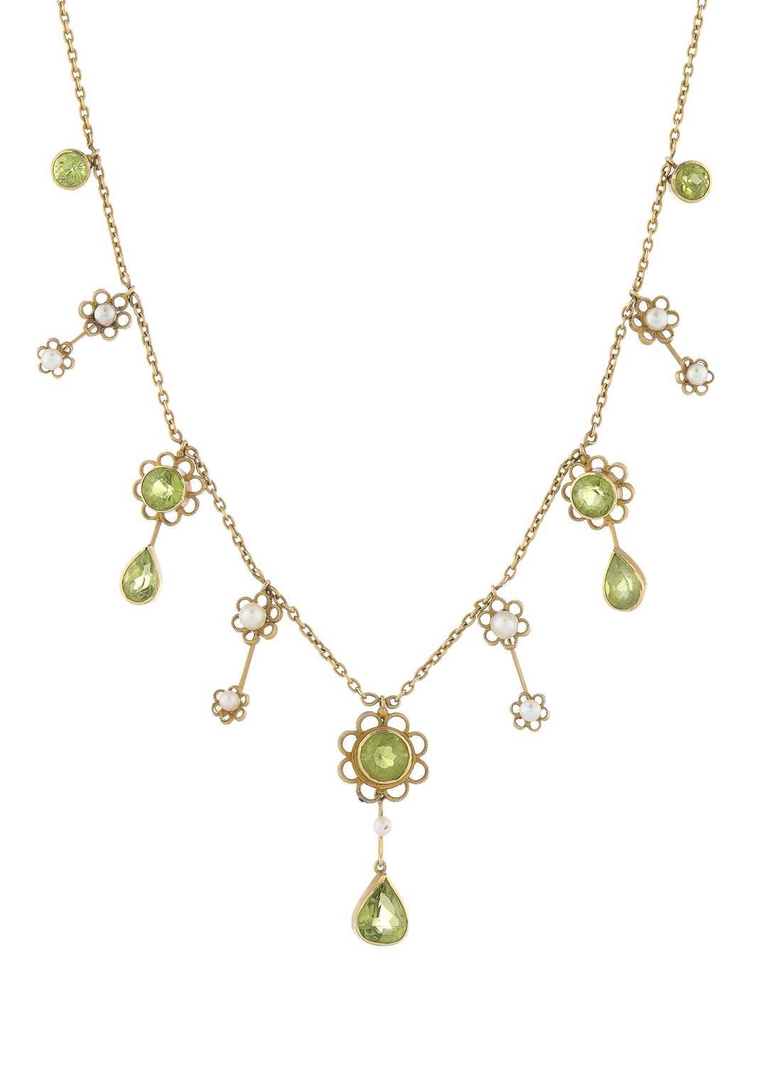 Lot 3 - An Edwardian 15ct gold peridot and seed pearl floral fringe necklace