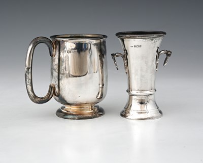 Lot 125 - An Elizabeth II silver mug, with loop handle,...