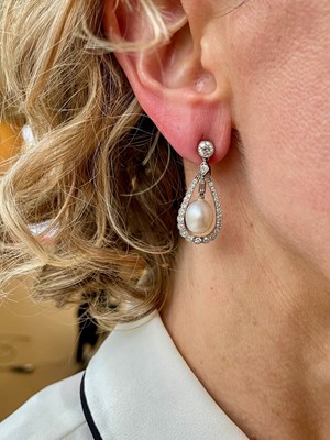 Lot 24 - A pair of Belle Epoque natural pearl and diamond drop earrings