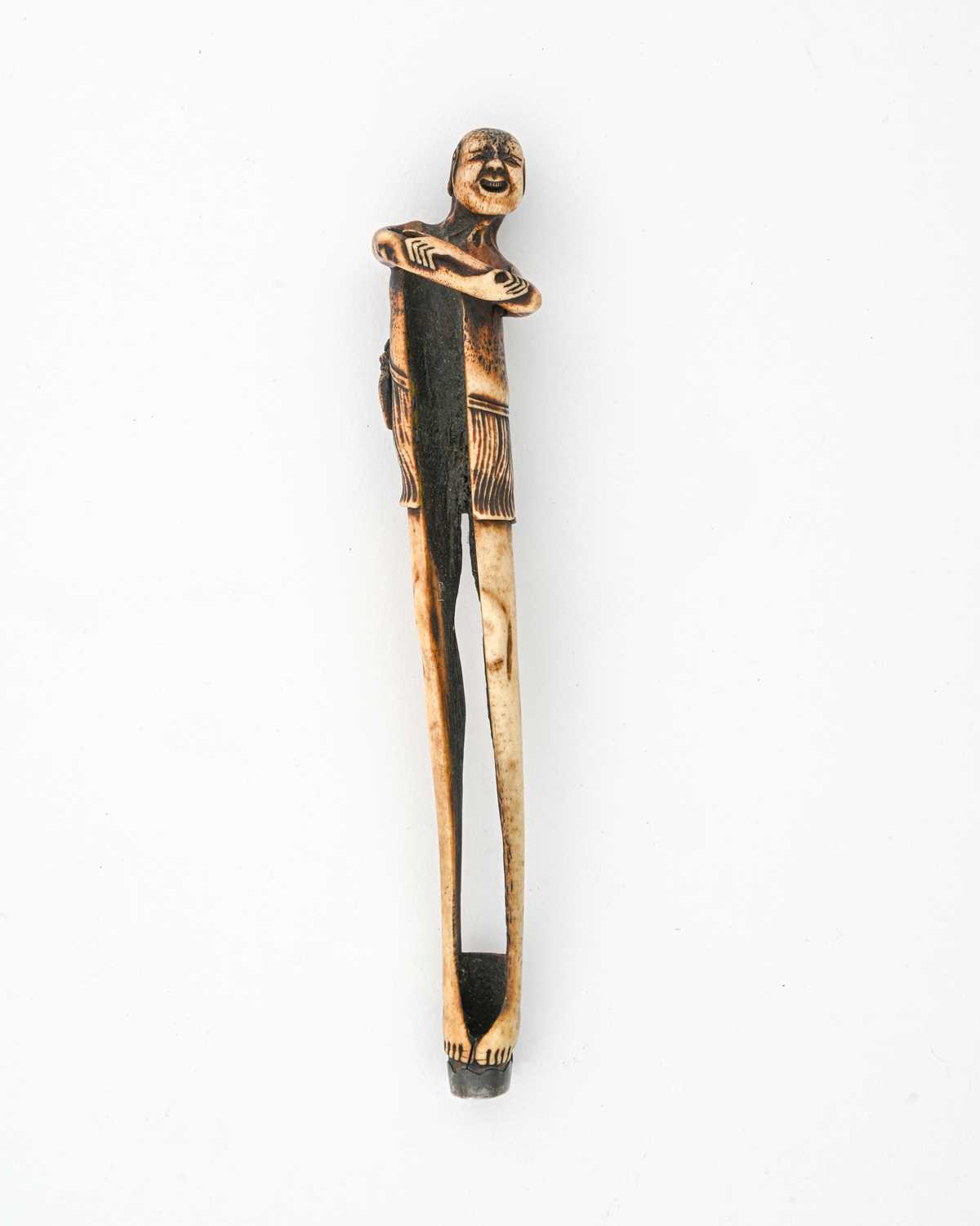 Lot 36 - A Japanese carved antler kiseruzutsu (pipe...