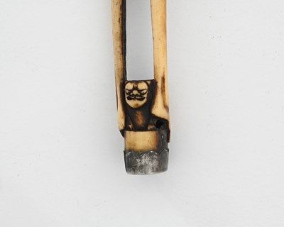 Lot 36 - A Japanese carved antler kiseruzutsu (pipe...