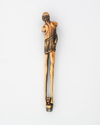 Lot 36 - A Japanese carved antler kiseruzutsu (pipe...