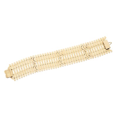 Lot 85 - An 18ct gold ruby and diamond articulated bracelet