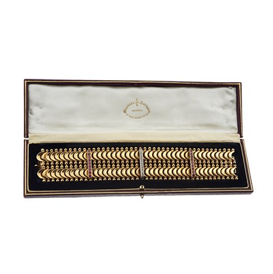 Lot 85 - An 18ct gold ruby and diamond articulated bracelet