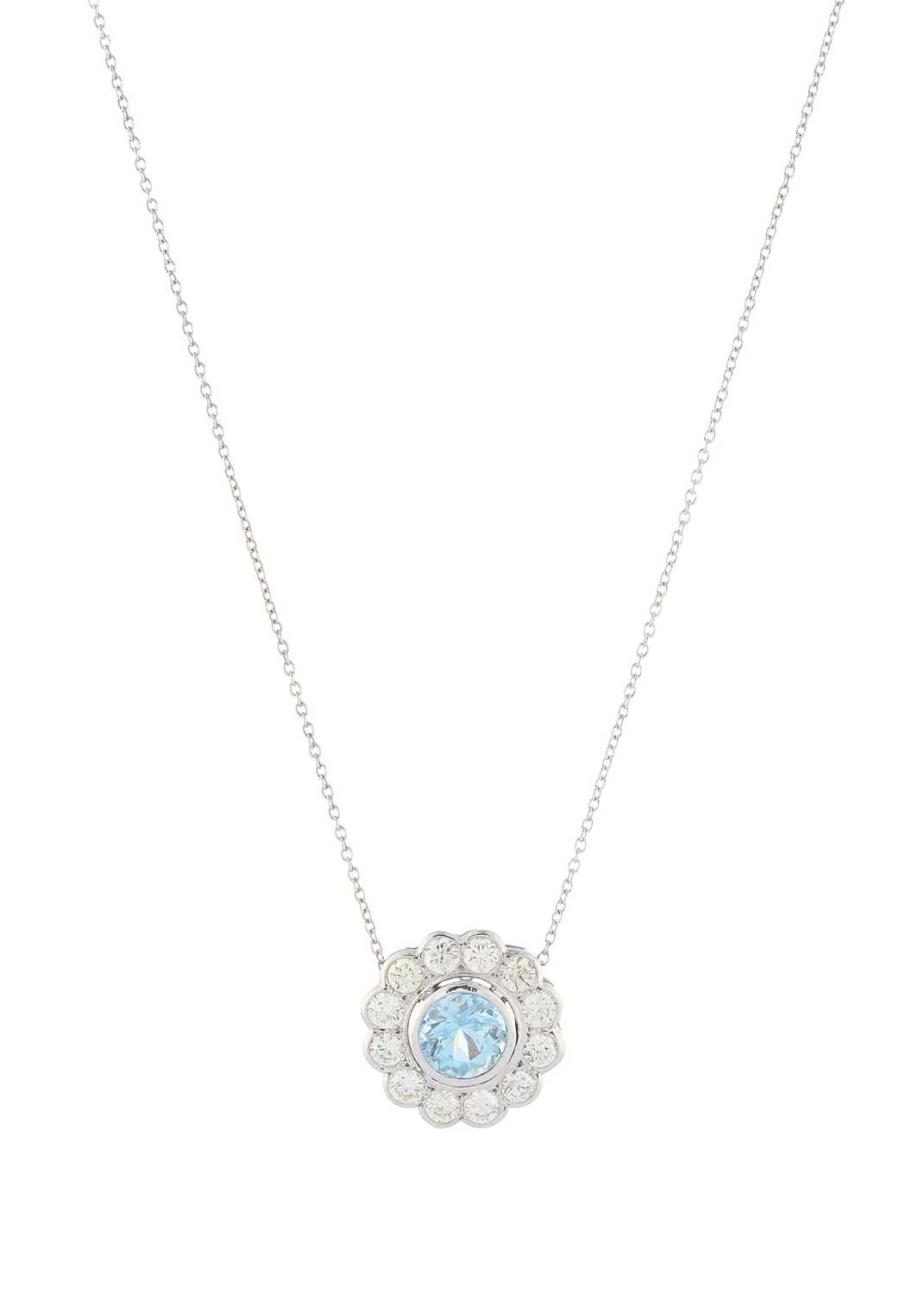 Lot 73 - An aquamarine and diamond cluster pendant, with chain