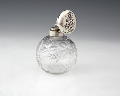 Lot 156 - An Edwardian silver-topped scent or perfume...