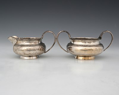 Lot 144 - A George V silver strawberry set, comprising a...
