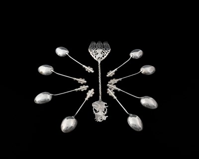 Lot 9 - A set of eight Eastern silver-coloured metal...