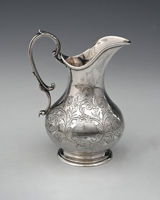 Lot 186 - A Victorian silver milk jug, of baluster form,...