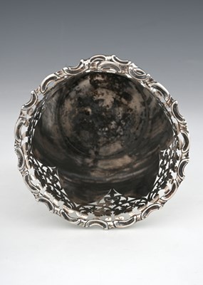 Lot 108 - A George V silver vase or bottle holder, of...