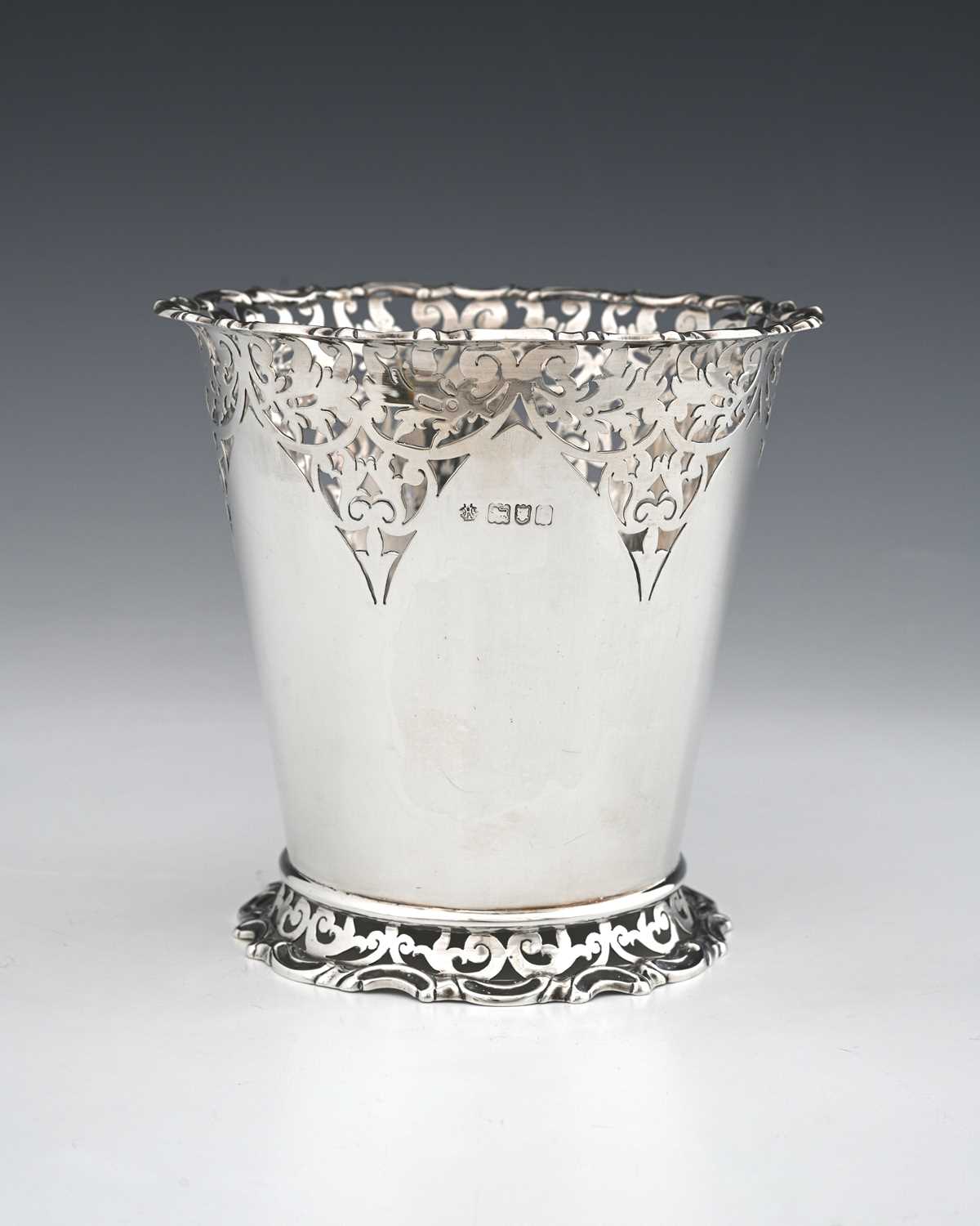 Lot 108 - A George V silver vase or bottle holder, of...