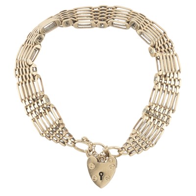 Lot 98 - A mid 20th century 9ct gold gate bracelet, with heart-shape padlock clasp