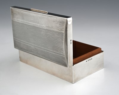 Lot 319 - A George VI silver cigarette box, of...
