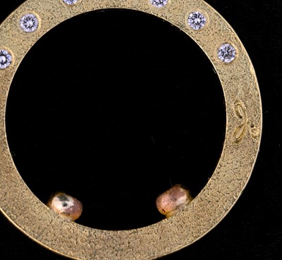 Lot 14 - An 18ct gold diamond band ring