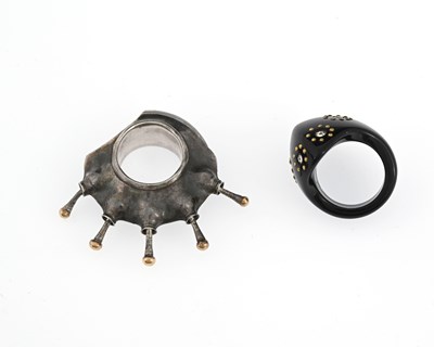 Lot 55 - An unusual silver ring, and a jet type ring, in the style of Jacqueline Cullen