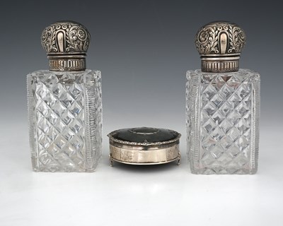 Lot 342 - A pair of Victorian silver-topped toilet...