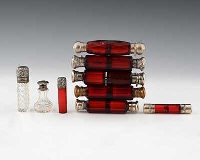 Lot 19 - A group of nine scent bottles or perfume...