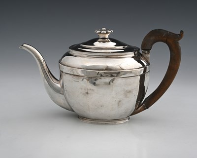 Lot 182 - A George III silver teapot, of oval panelled...