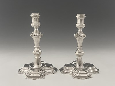 Lot 445 - A pair of George II silver candlesticks,...