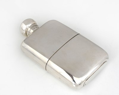 Lot 328 - A George V silver spirits flask, of cushion...
