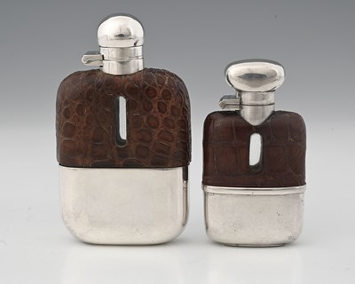 Lot 517 - A silver-mounted spirits flask, the glass body...