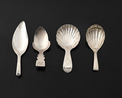 Lot 131 - A group of four George III silver caddy spoons,...