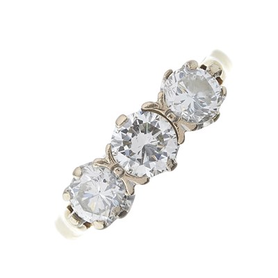 Lot 99 - An 18ct gold brilliant-cut diamond three-stone...