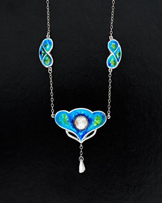Lot 23 - An Arts and Crafts enamelled silver and pearl...