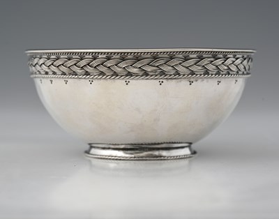 Lot 529 - An Edwardian Arts & Crafts silver bowl, with...