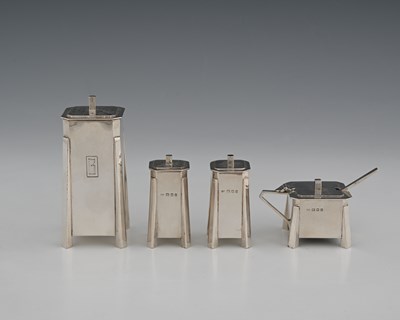 Lot 474 - Charles Boyton, a three-piece Art Deco silver...