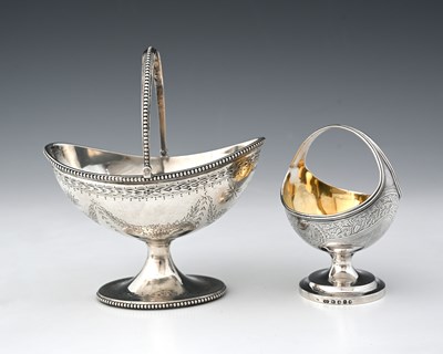 Lot 99 - A Victorian silver navette swing handle basket...