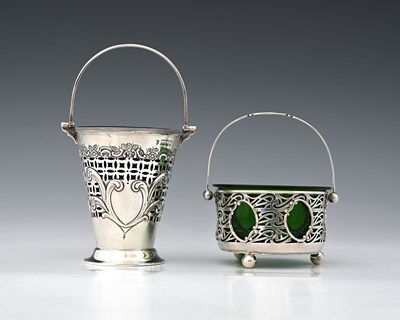 Lot 117 - An Edwardian Art Nouveau silver swing handle...