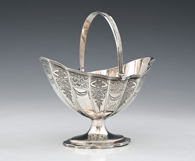 Lot 90 - A George III silver navette swing handle...