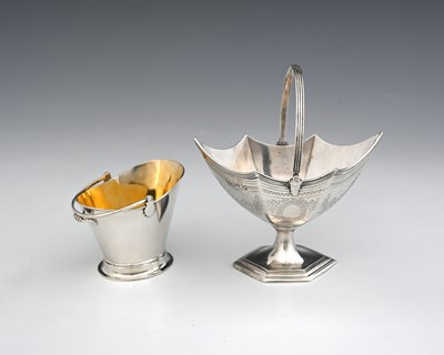 Lot 395 - A Victorian silver navette swing handled sugar...
