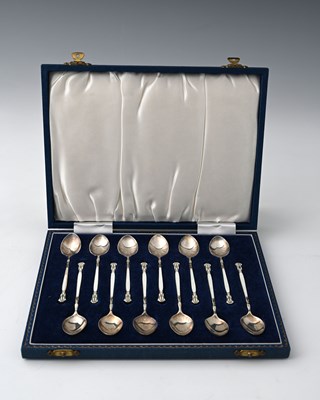 Lot 202 - A set of twelve silver and enamel coffee...