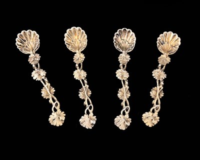 Lot 229 - A matched set of four cast silver-gilt...
