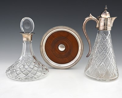 Lot 279 - An Elizabeth II ships decanter on stand, with...