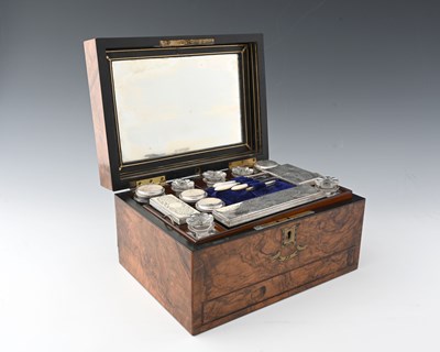 Lot 21 - A nineteenth-century walnut dressing table...