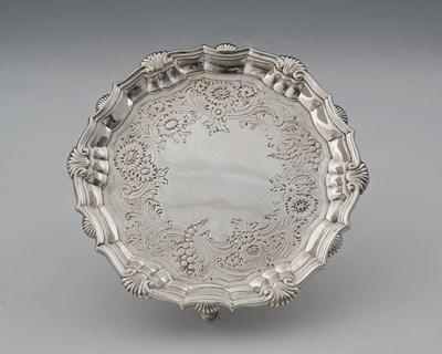 Lot 274 - A George II silver waiter, the border...