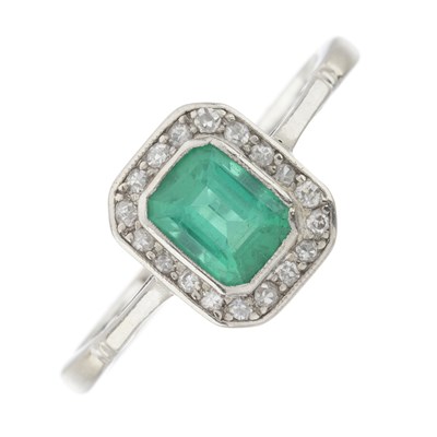 Lot 82 - A mid 20th century 18ct gold and platinum emerald and diamond cluster ring
