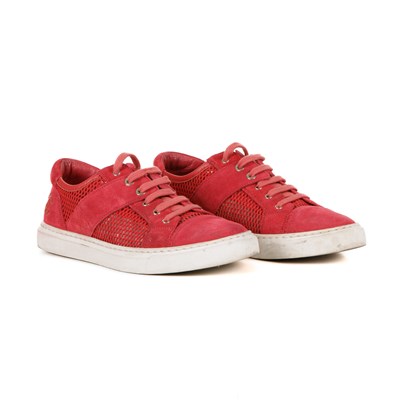 Lot 318 - Chanel, a pair of red CC sneakers.